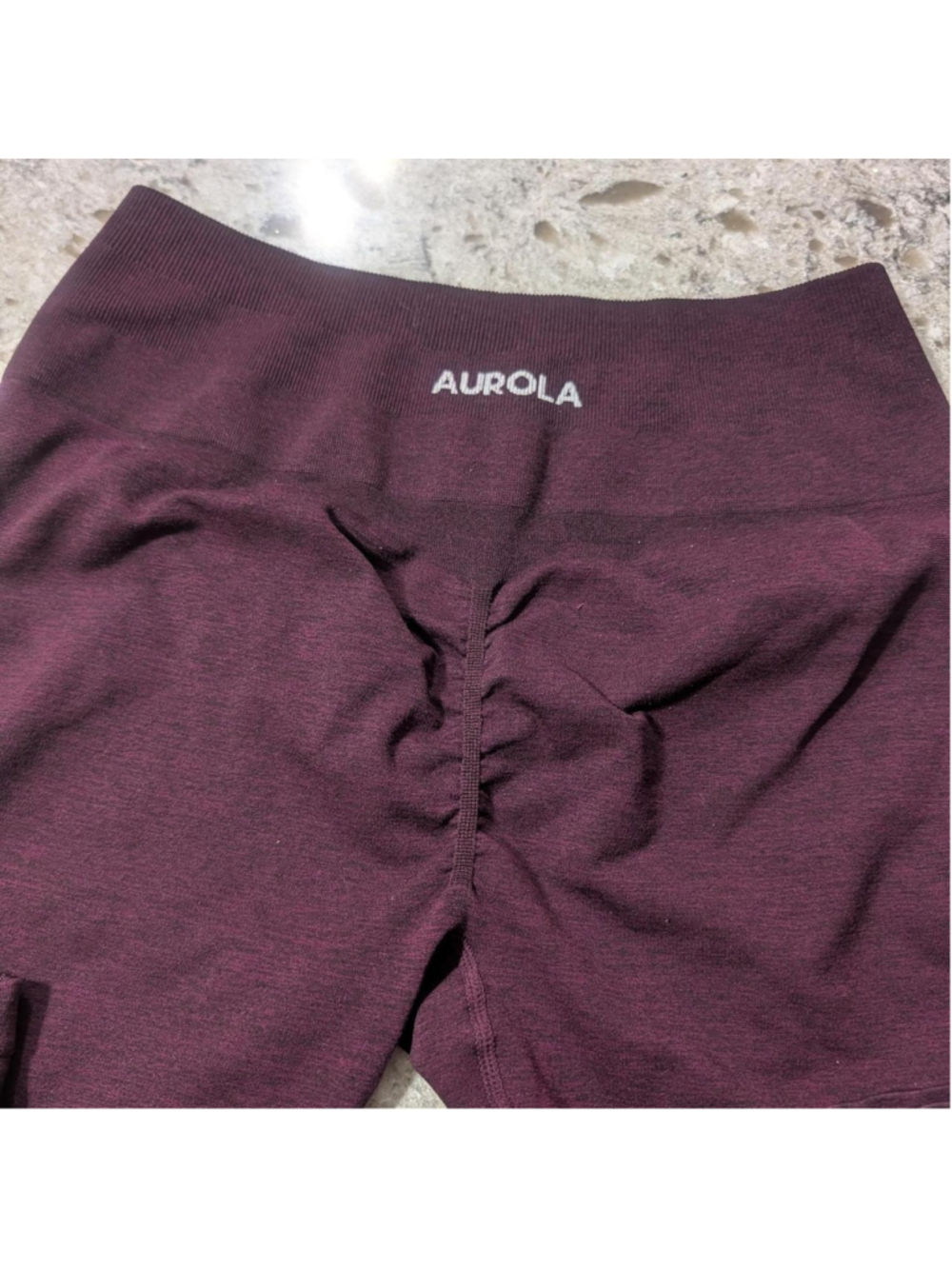Aurola leggings with ruched back detail and tummy control in the color dark cher
